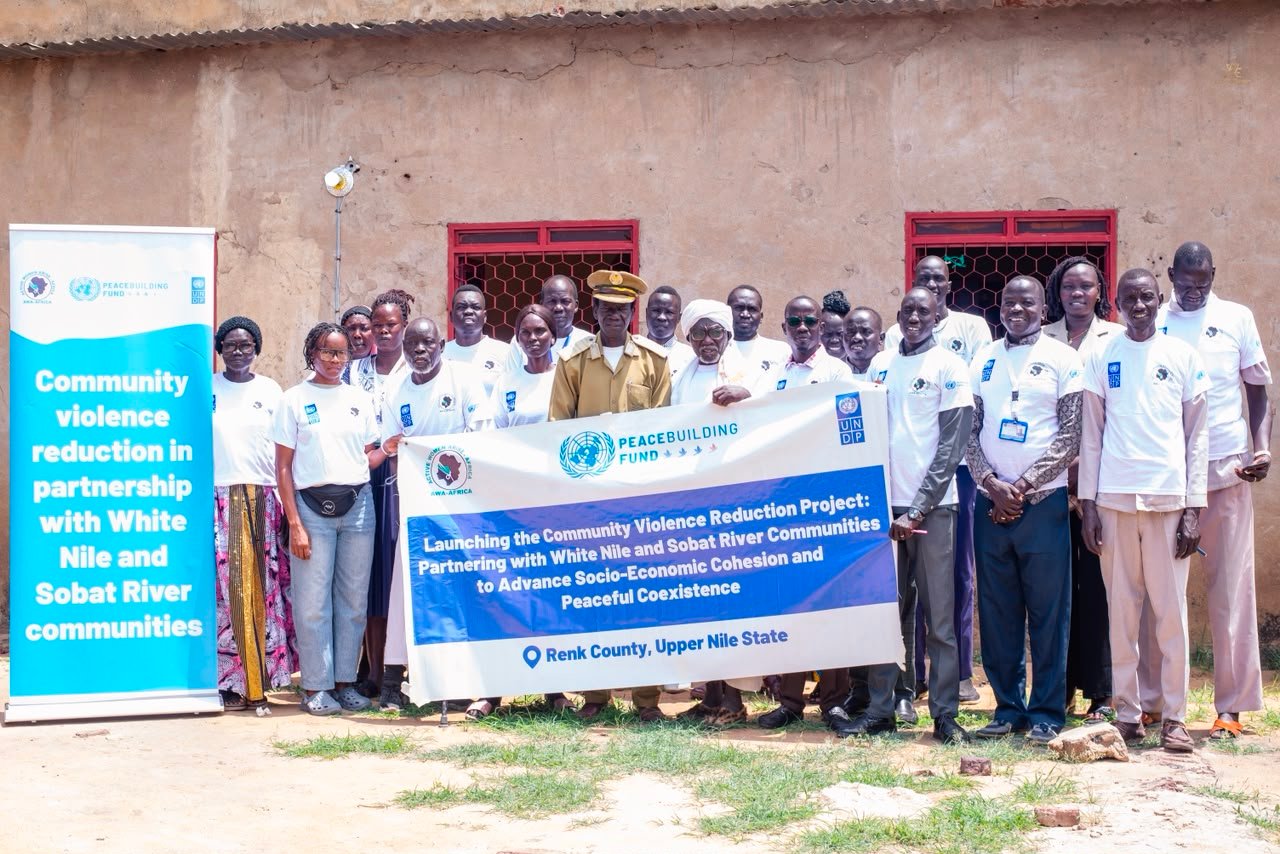 Wide view of the community gathering at the project launch in Renk County